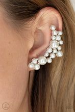 Load image into Gallery viewer, A collection of bubbly white pearls dot a shiny silver frame that branches up the ear for a modern, timeless twist. Earring attaches to a standard post fitting. Features a clip-on fitting at the top for a secure fit.  Sold as one pair of ear crawlers.
