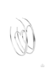 Load image into Gallery viewer, Shiny silver wire delicately bends into an airy heart frame inside a classic silver hoop, creating a flirtatious display. Earring attaches to a standard post fitting. Hoop measures approximately 2&quot; in diameter.  Sold as one pair of hoop earrings.
