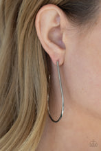 Load image into Gallery viewer, A shiny silver bar sleekly curls into an elongated hoop for a chic look. Earring attaches to a standard post fitting. Hoop measures approximately 1 1/2&quot; in diameter.  Sold as one pair of hoop earrings.
