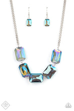 Load image into Gallery viewer, Gorgeously oversized blue emerald cut gems boldly link below the collar, creating an iridescently icy statement piece. Features an adjustable clasp closure.  Sold as one individual necklace. Includes one pair of matching earrings.
