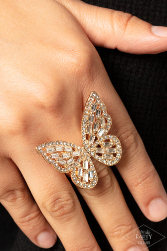 Dainty white emerald cut rhinestones are sprinkled across the golden wings of a butterfly that is encrusted in glassy white rhinestones for a dramatically dazzling finish. Features a stretchy band for a flexible fit.  Sold as one individual ring.