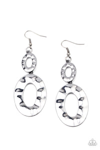 A mismatched pair of hammered gunmetal ovals delicately link into a blinding metallic lure. Earring attaches to a standard fishhook fitting.  Sold as one pair of earrings.