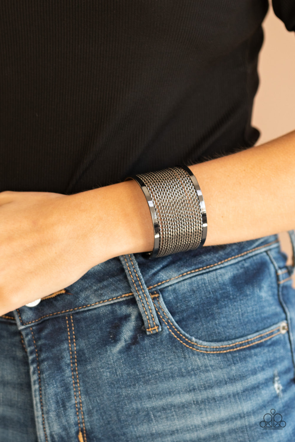 Twisted rows of gunmetal wire layer between two flat gunmetal bars, coalescing into a boldly stacked cuff around the wrist.  Sold as one individual bracelet.