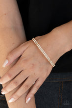 Load image into Gallery viewer, Held together with dainty gold fittings, two glittery strands of white rhinestones delicately curl around the wrist for a timeless finish.  Sold as one individual bracelet.
