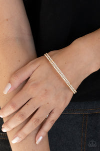 Held together with dainty gold fittings, two glittery strands of white rhinestones delicately curl around the wrist for a timeless finish.  Sold as one individual bracelet.