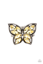 Load image into Gallery viewer, The wings of a studded silver butterfly have been adorned in glittery yellow marquise rhinestones, creating a glamorous centerpiece atop the finger. Features a stretchy band for a flexible fit.  Sold as one individual ring.
