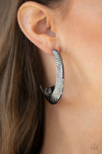 Load image into Gallery viewer, Etched in sporadic linear patterns, two shimmery gunmetal frames join into a hollow hook that flares out into an eye-catching hoop. Earring attaches to a standard post fitting. Hoop measures approximately 1 1/2&quot; in diameter.  Sold as one pair of hoop earrings.
