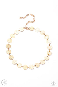 Hammered in shimmery detail, a shiny collection of dainty gold discs delicately link into a blinding display around the neck. Features an adjustable clasp closure.  Sold as one individual choker necklace. Includes one pair of matching earrings.