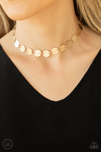Hammered in shimmery detail, a shiny collection of dainty gold discs delicately link into a blinding display around the neck. Features an adjustable clasp closure.  Sold as one individual choker necklace. Includes one pair of matching earrings.