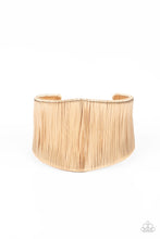 Load image into Gallery viewer, A seemingly infinite collection of shimmery gold wire wraps around the a substantial gold cuff, creating a bold industrial inspired centerpiece around the wrist.  Sold as one individual bracelet.
