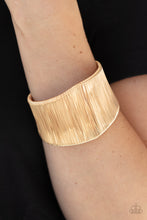 Load image into Gallery viewer, A seemingly infinite collection of shimmery gold wire wraps around the a substantial gold cuff, creating a bold industrial inspired centerpiece around the wrist.  Sold as one individual bracelet.
