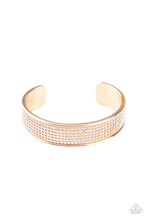 Load image into Gallery viewer, Row after row of white rhinestones are encrusted along the front of a thick gold cuff, creating a blinding statement piece around the wrist.  Sold as one individual bracelet.
