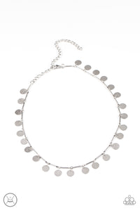 Hammered shiny silver discs swing from interconnected shimmery silver bars around the neck, creating a shimmery fringe. Features an adjustable clasp closure.  Sold as one individual choker necklace. Includes one pair of matching earrings.
