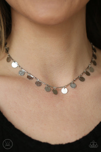 Hammered shiny silver discs swing from interconnected shimmery silver bars around the neck, creating a shimmery fringe. Features an adjustable clasp closure.  Sold as one individual choker necklace. Includes one pair of matching earrings.