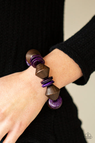 Purple wooden discs and chunky brown wooden beads are threaded along a stretchy band around the wrist, creating a summery look.  Sold as one individual bracelet.