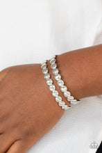 Load image into Gallery viewer, Brushed in a shiny finish, rows of flattened silver studs coalesce into a shimmery cuff around the wrist.  Sold as one individual bracelet.
