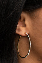 Load image into Gallery viewer, The spine of a gold hoop is encrusted in dainty white rhinestones, creating wraparound shimmer. Earring attaches to a standard post fitting. Hoop measures approximately 1 3/4&quot; in diameter.  Sold as one pair of hoop earrings.

