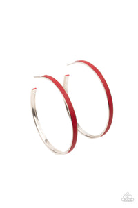 A red leather lace is pressed along the indented spine of a silver hoop, creating a bold pop of color. Earring attaches to a standard post fitting. Hoop measures approximately 2 1/4" in diameter.  Sold as one pair of hoop earrings.