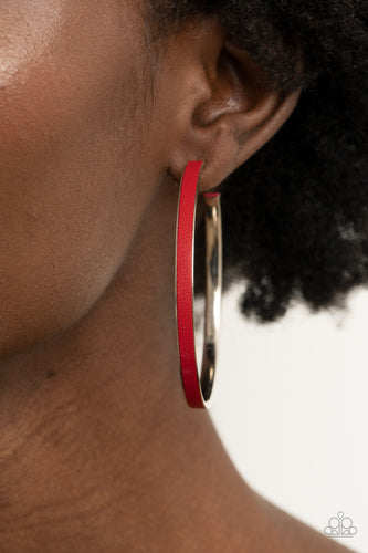 A red leather lace is pressed along the indented spine of a silver hoop, creating a bold pop of color. Earring attaches to a standard post fitting. Hoop measures approximately 2 1/4