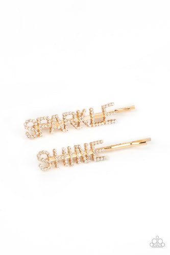 Glassy white rhinestones spell out 