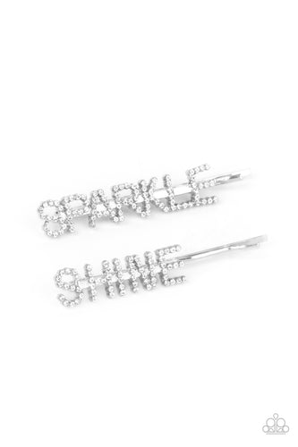 Glassy white rhinestones spell out 