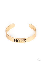 Load image into Gallery viewer, The center of a shiny gold cuff is stamped in the word, &quot;Hope,&quot; for an inspirational look.  Sold as one individual bracelet.
