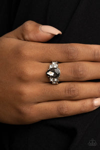 Trios of glassy white rhinestones flank an oversized smoky teardrop rhinestone, creating a sparkly centerpiece atop a dainty silver band. Features a dainty stretchy band for a flexible fit.  Sold as one individual ring.