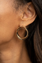 Load image into Gallery viewer, Thick gold rings intricately interlock into a stacked frame for an edgy look. Earring attaches to a standard post fitting.  Sold as one pair of post earrings.
