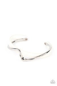 A flat silver bar delicately curls across a dainty white shell-like acrylic cuff, creating a whimsical centerpiece around the wrist.  Sold as one individual bracelet.