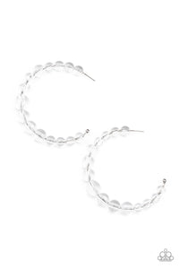 Gradually increasing in size at the center, a glassy collection of white beads are threaded along an oversized hoop for a bubbly effect. Earring attaches to a standard post fitting. Hoop measure approximately 2 1/2" in diameter.  Sold as one pair of hoop earrings.