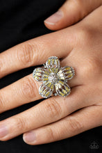 Load image into Gallery viewer, Yellow emerald-style rhinestones adorn the silver petals of a blooming flower featuring a white rhinestone encrusted beaded center. The tips of the colorful petals are dusted in dainty white rhinestones, adding extra shimmer to the sparkly centerpiece. Features a stretchy band for a flexible fit.  Sold as one individual ring.
