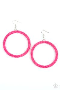 A dainty strand of vivacious pink seed beads wrap around a silver hoop, creating a bubbly hoop. Earring attaches to a standard fishhook fitting.  Sold as one pair of earrings.