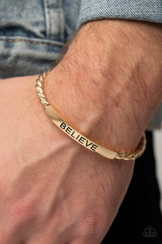Twisted gold bars attach to a shiny gold plate stamped in the word, 