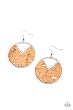 Load image into Gallery viewer, Featuring hints of white accents, an earthy piece of cork is placed into the center of a circular hoop. A triangular slice is removed from the cork, creating an edgy airy finish. Earring attaches to a standard fishhook fitting.  Sold as one pair of earrings.
