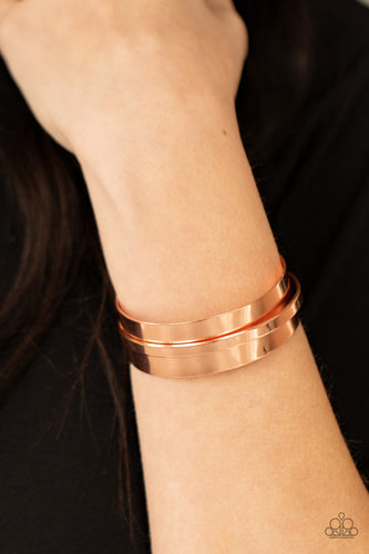 A flat shiny copper bar curves around the center of a thick shiny copper cuff, creating a chic stacked look.  Sold as one individual bracelet.
