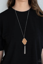 Load image into Gallery viewer, Flecked in glittery silver sparkles, a scalloped cork frame is pressed into a sleek silver frame at the bottom of a dainty silver satellite chain. A classic silver chain tassel swings from the whimsical pendant, adding flirtatious movement to the one-of-a-kind display. Features an adjustable clasp closure.  Sold as one individual necklace. Includes one pair of matching earrings.
