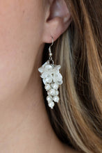 Load image into Gallery viewer, A cluster of pearly white floral frames and dainty white pearls trickle from a silver chain, creating a romantic chandelier. Earring attaches to a standard fishhook fitting.  Sold as one pair of earrings.
