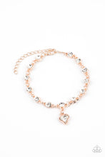 Load image into Gallery viewer, Brilliant white rhinestones in rose gold settings are linked together and accented with a charming white rhinestone heart that dangles sweetly from the wrist. Features an adjustable clasp closure.  Sold as one individual bracelet.

