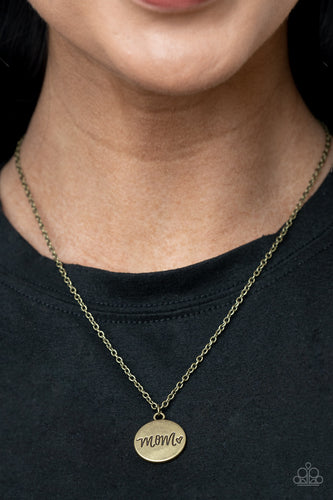 A dainty heart engraved next to the word 