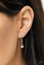 Load image into Gallery viewer, Pink rhinestone hanging from a silver fish hook earring.
