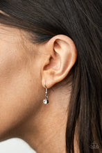 Load image into Gallery viewer, Single white rhinestone, hanging from a silver fish hook earring.
