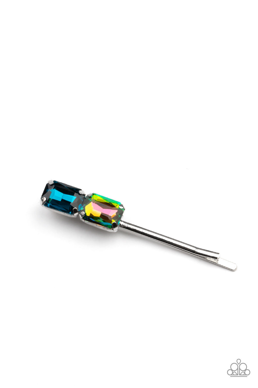 Featuring elegant emerald style cuts, an oversized pair of blue and oil spill rhinestones adorn the end of a classic silver bobby pin.  Sold as one individual bobby pin.