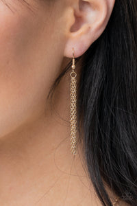Long chain tassel, hanging from a gold fish hook earring.