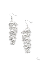 Load image into Gallery viewer, An explosion of glittery white rhinestones and oversized pearls coalesce into an exaggerated leafy silver lure, creating a dramatic statement piece. Earring attaches to a standard fishhook fitting.  Sold as one pair of earrings.
