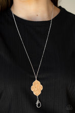 Load image into Gallery viewer, A scalloped cork frame is pressed into a sleek silver frame at the bottom of a dainty silver satellite chain. A lobster clasp hangs from the bottom of the design to allow a name badge or other item to be attached. Features an adjustable clasp closure.  Sold as one individual lanyard. Includes one pair of matching earrings.
