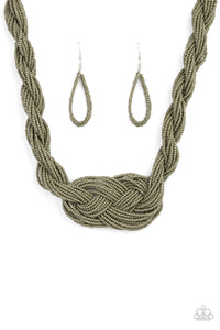 Countless strands of Martini Olive seed beads are twisted and knotted together to create an unforgettable statement piece. Features an adjustable clasp closure.  Sold as one individual necklace. Includes one pair of matching earrings.