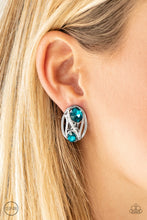 Load image into Gallery viewer, Encrusted in a section of radiant white rhinestones, glistening silver bars spin around two glittery blue rhinestones for a regal look. Earring attaches to a standard clip-on fitting. Sold as one pair of clip-on earrings.
