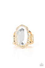 Load image into Gallery viewer, A dramatically oversized oval white gem adorns the center of a scalloped gold frame dusted in dainty white rhinestones, creating a commanding centerpiece atop the finger. Features a stretchy band for a flexible fit.  Sold as one individual ring.
