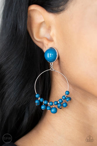 Shiny blue beads are threaded along a dainty wire hoop that attaches to an oversized blue beaded fitting, creating a bubbly fringe. Earring attaches to a standard clip-on fitting.  Sold as one pair of clip-on earrings.