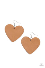 Load image into Gallery viewer, A brown tan leather heart frame swings from the ear for a flirtatiously neutral pop of color. Earring attaches to a standard fishhook fitting.  Sold as one pair of earrings.
